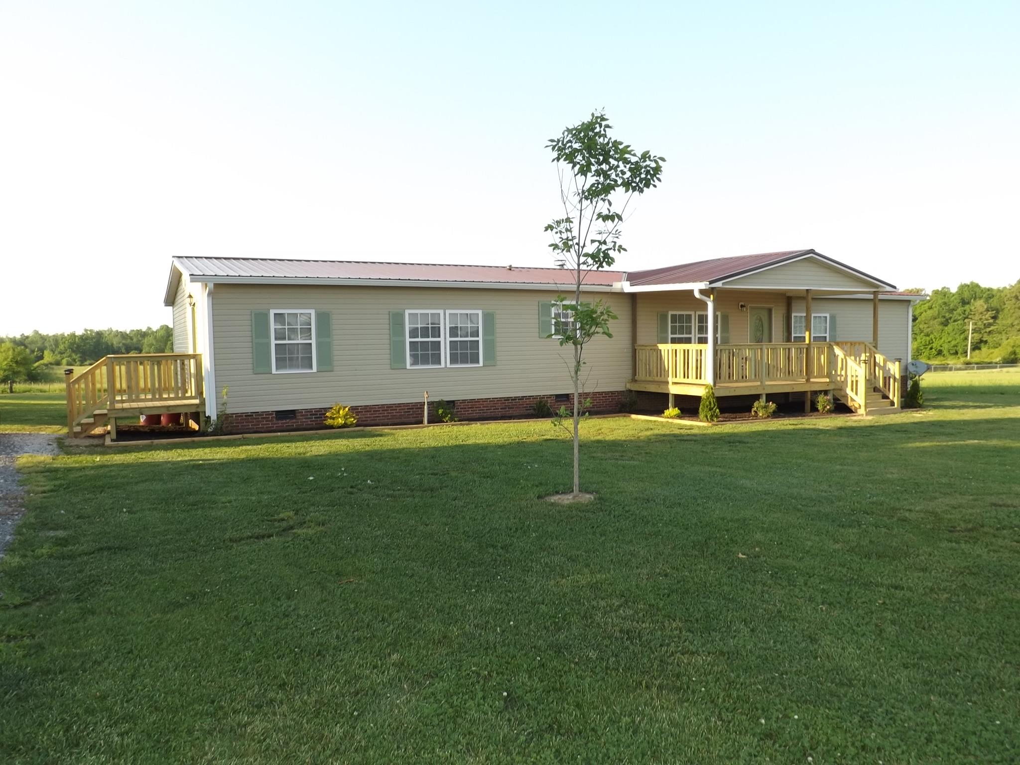 614 Ferrells Loop Road Beechgrove, TN 37018 - Photo 2 of 28 a front view of house with yard and green space