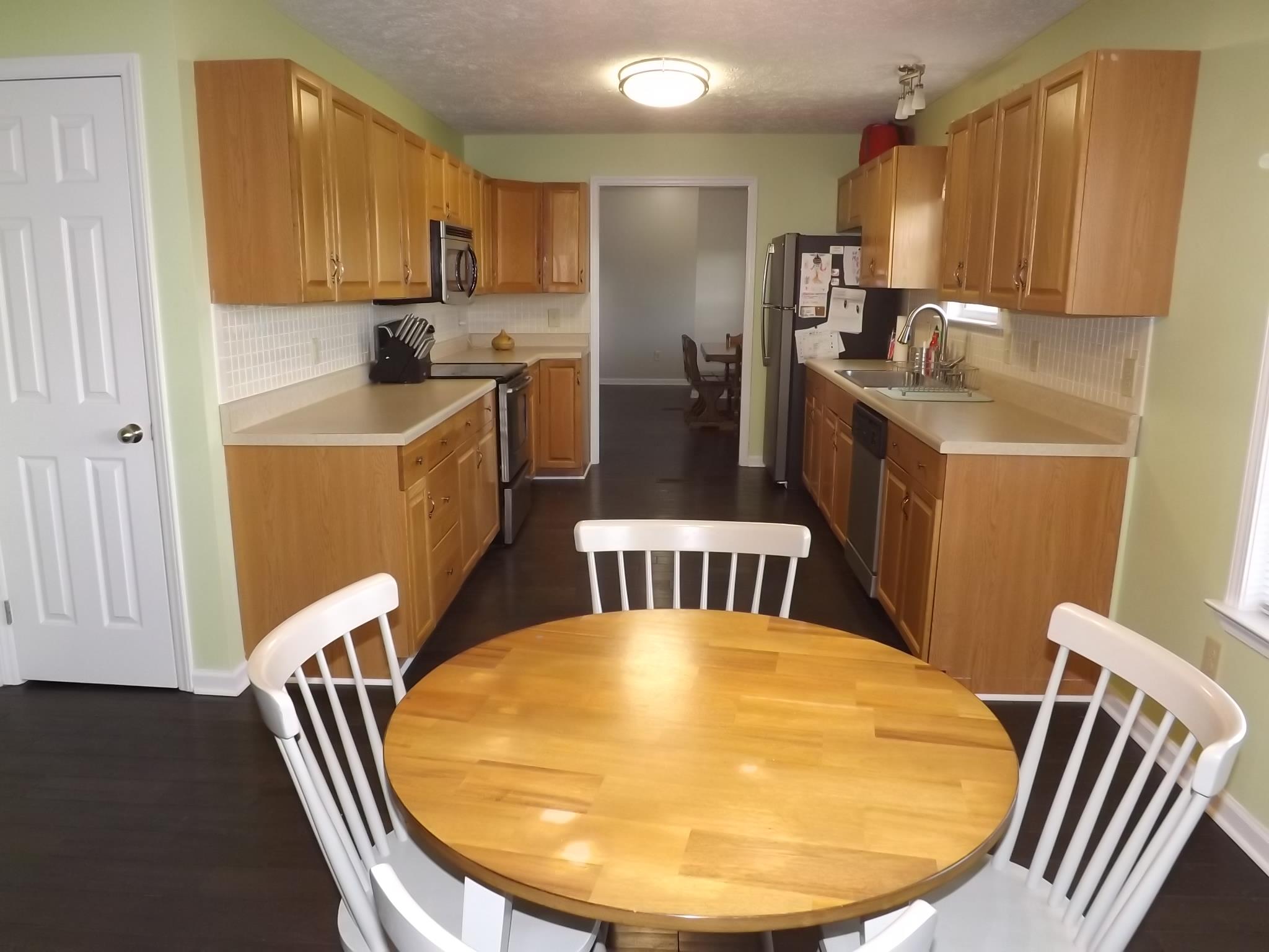 614 Ferrells Loop Road Beechgrove, TN 37018 - Photo 12 of 28 a view of kitchen with furniture and wooden floor