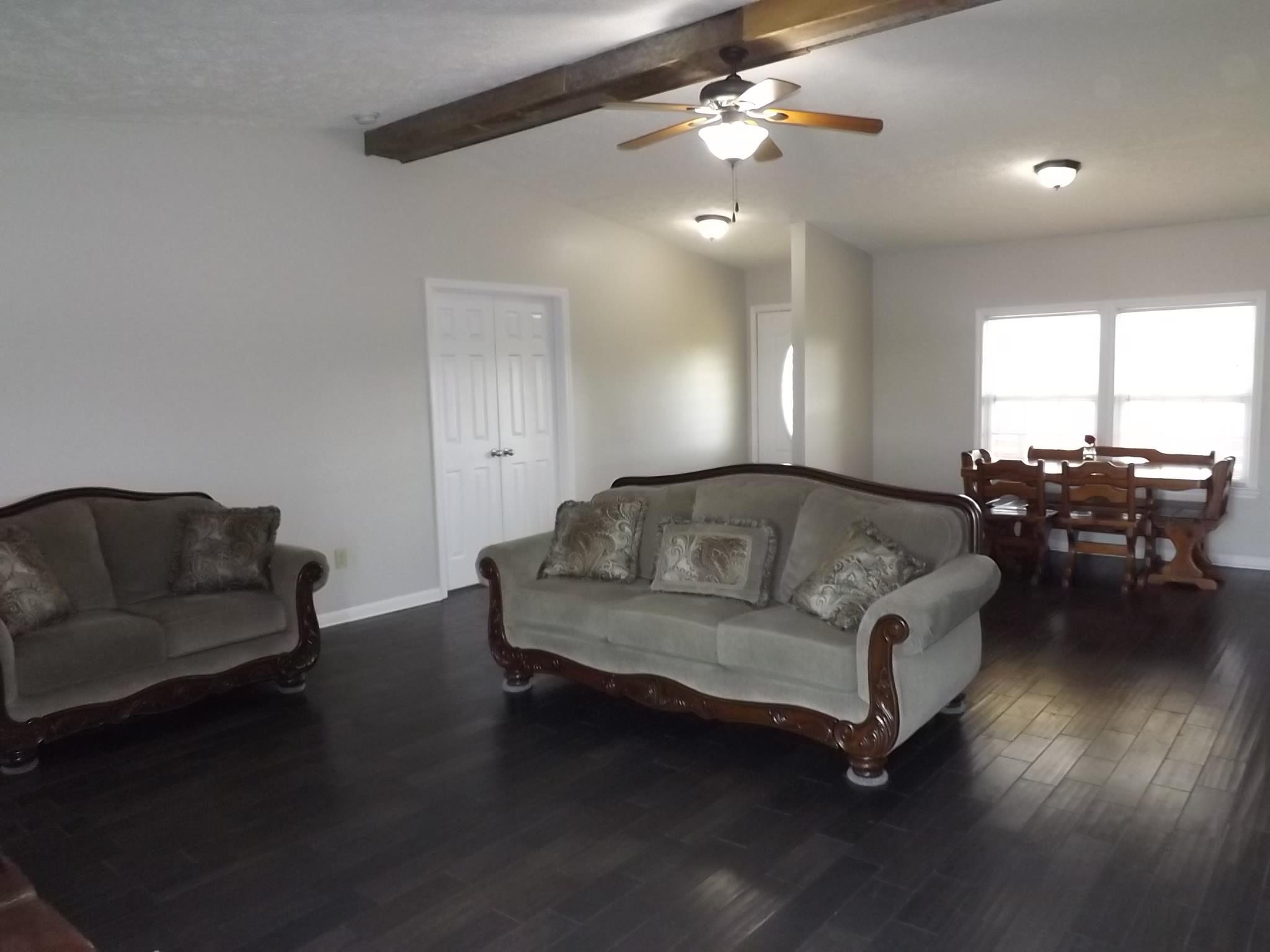 614 Ferrells Loop Road Beechgrove, TN 37018 - Photo 3 of 28 a living room with furniture and wooden floor