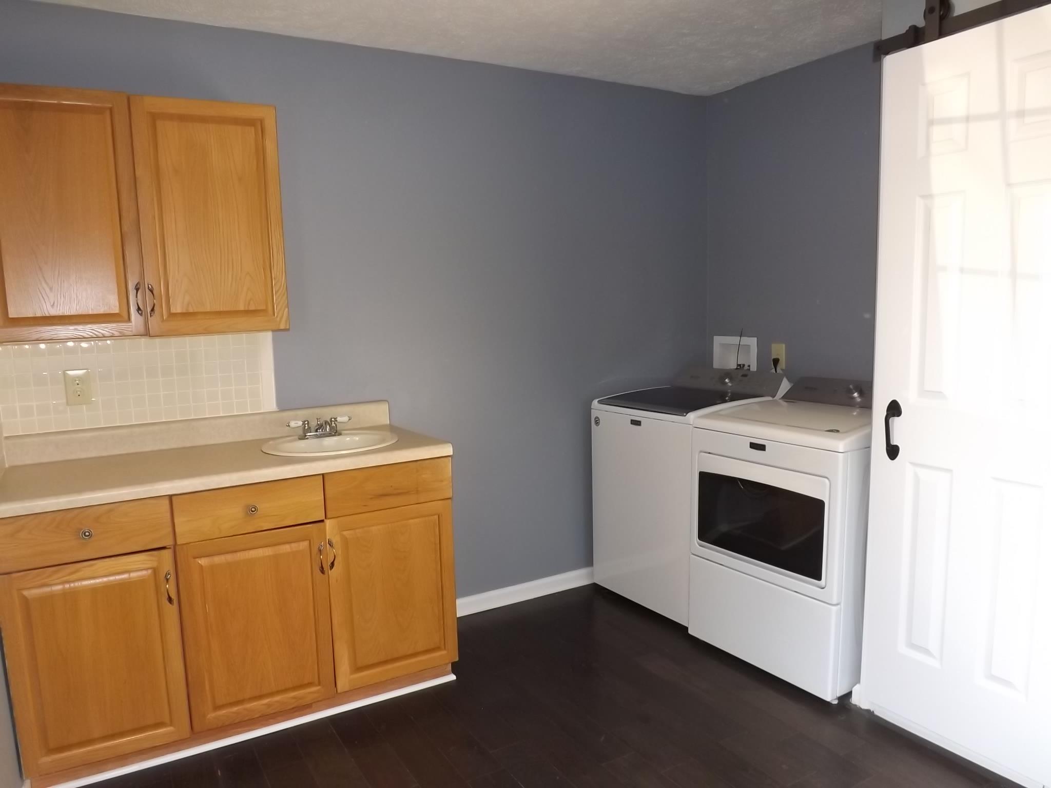 614 Ferrells Loop Road Beechgrove, TN 37018 - Photo 25 of 28 a utility room with dryer and washer