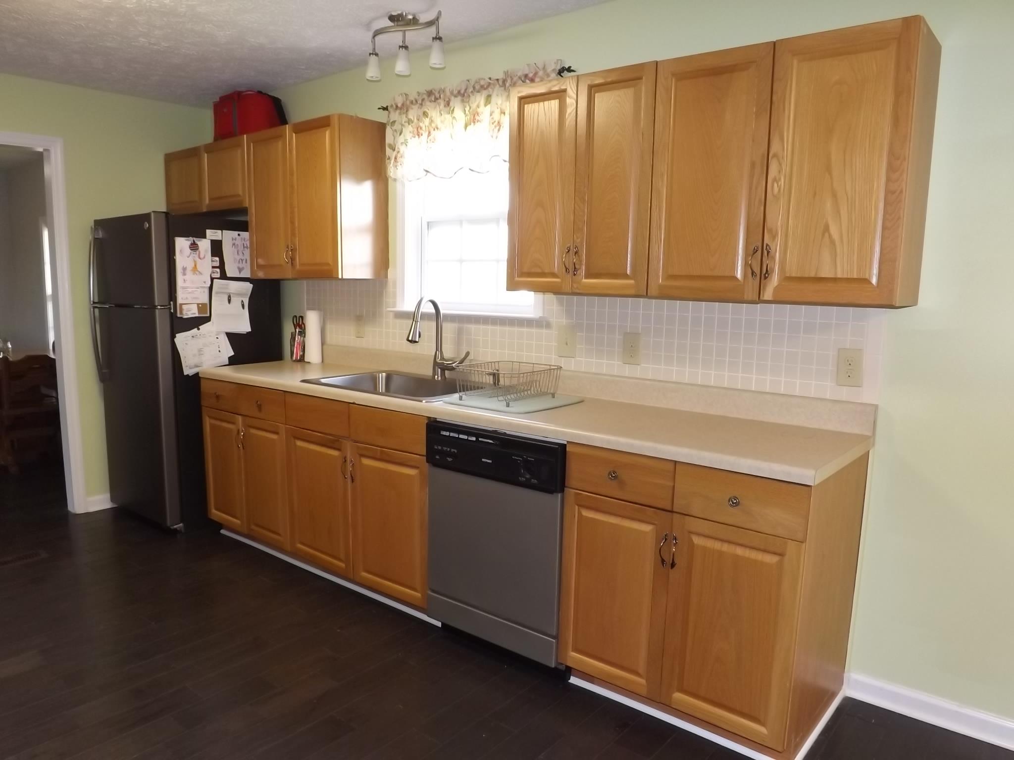 614 Ferrells Loop Road Beechgrove, TN 37018 - Photo 9 of 28 a kitchen with a sink cabinets and a window