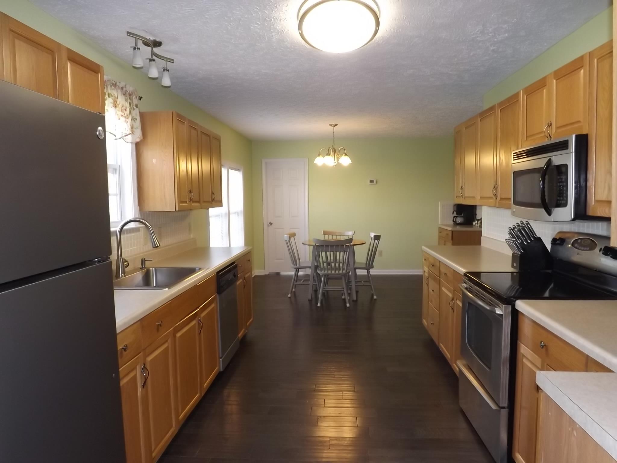 614 Ferrells Loop Road Beechgrove, TN 37018 - Photo 10 of 28 a kitchen with lots of counter top space and stainless steel appliances