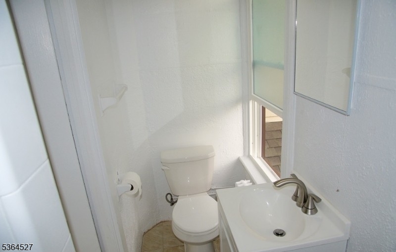 76 Grove Street Montclair, NJ 07042 - Photo 10 of 15 a bathroom with a sink and a toilet