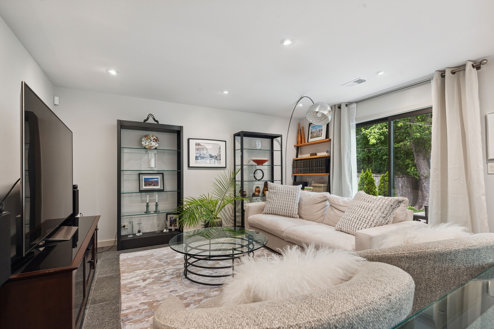 1231 Ridge Road Highland Park, IL 60035 - Photo 11 of 30 a living room with furniture a large window and a flat screen tv