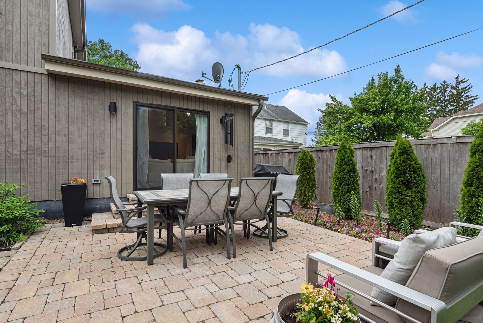1231 Ridge Road Highland Park, IL 60035 - Photo 24 of 30 a view of a patio with table and chairs potted plants and floor to ceiling window