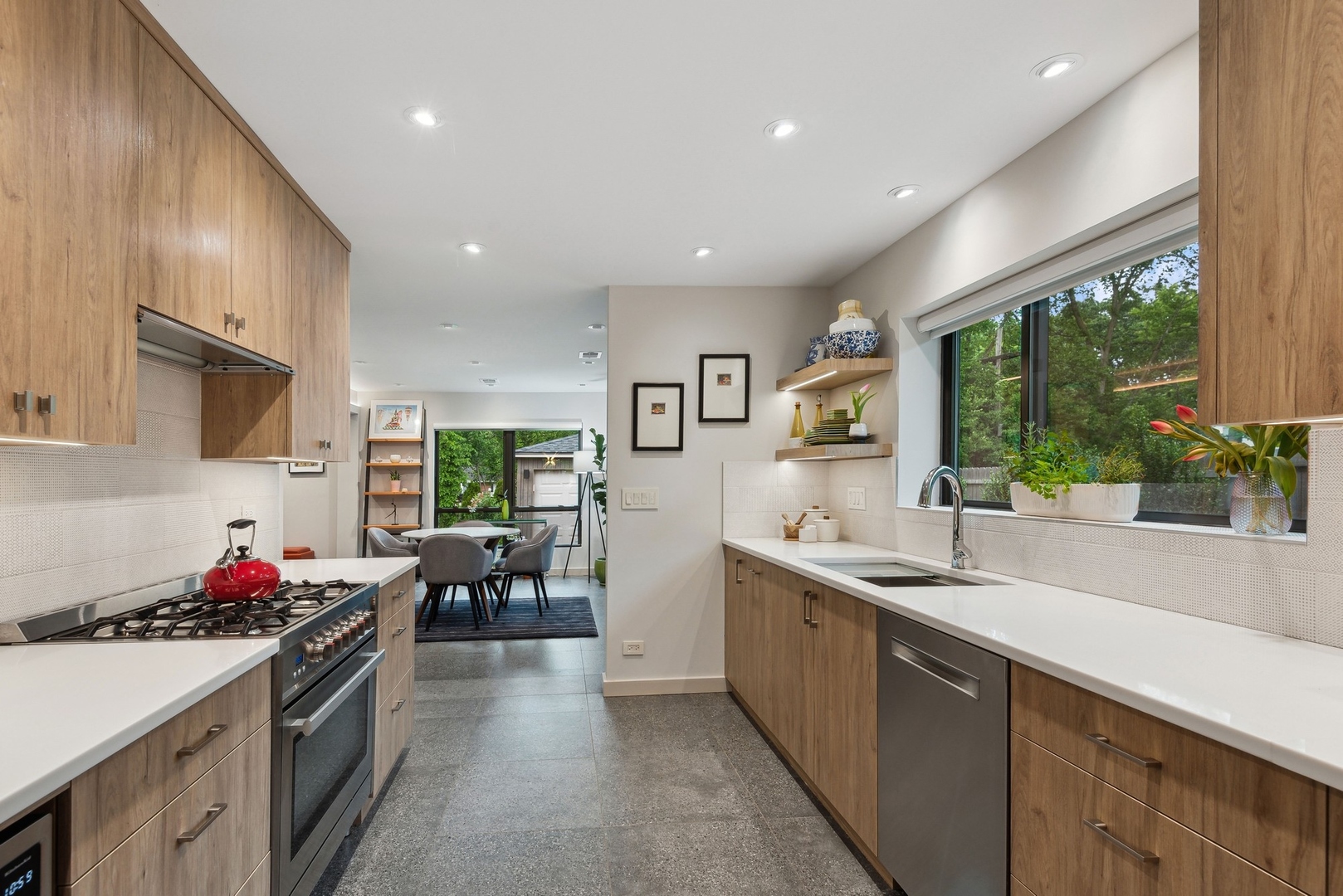 1231 Ridge Road Highland Park, IL 60035 - Photo 6 of 30 a kitchen with granite countertop a sink stove and cabinets