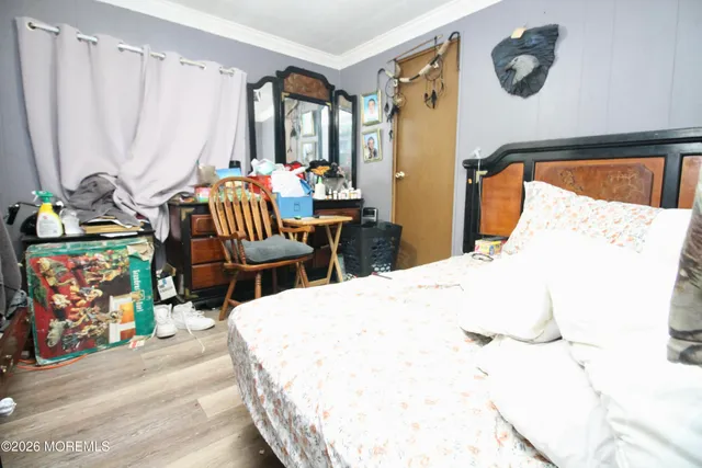 a bedroom with bed and a window