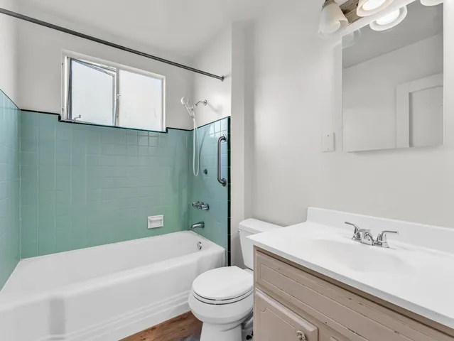 a bathroom with a sink a toilet and bathtub