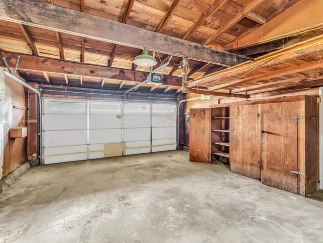 a view of a room with wooden walls