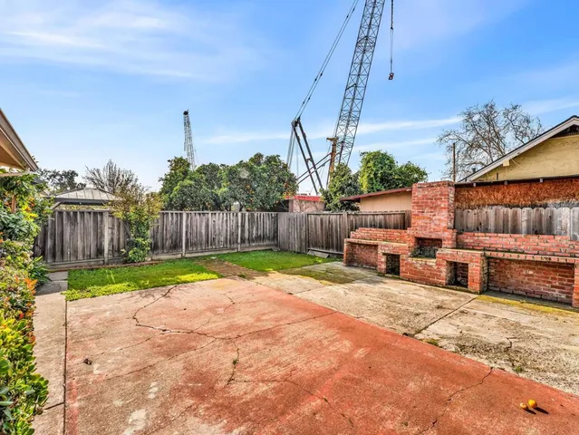 a view of a backyard with a patio