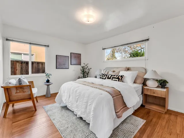 a bedroom with bed and window