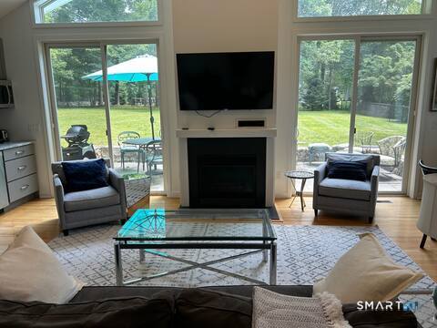 9 Fall Ridge Road Weston, CT 06883 - Photo 30 of 39 Living room with view to patio (in cottage)