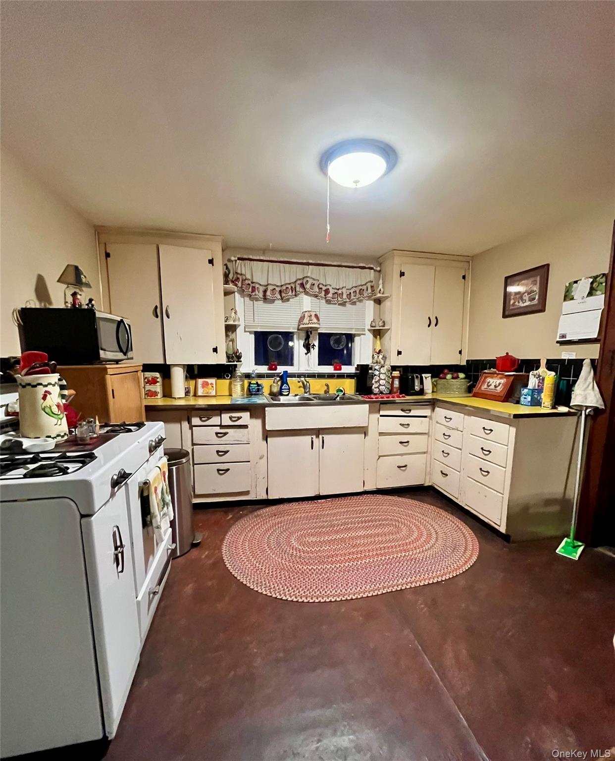 35 Spring Street Goshen, NY 10924 - Photo 8 of 26 a kitchen with lots of appliances and cabinets