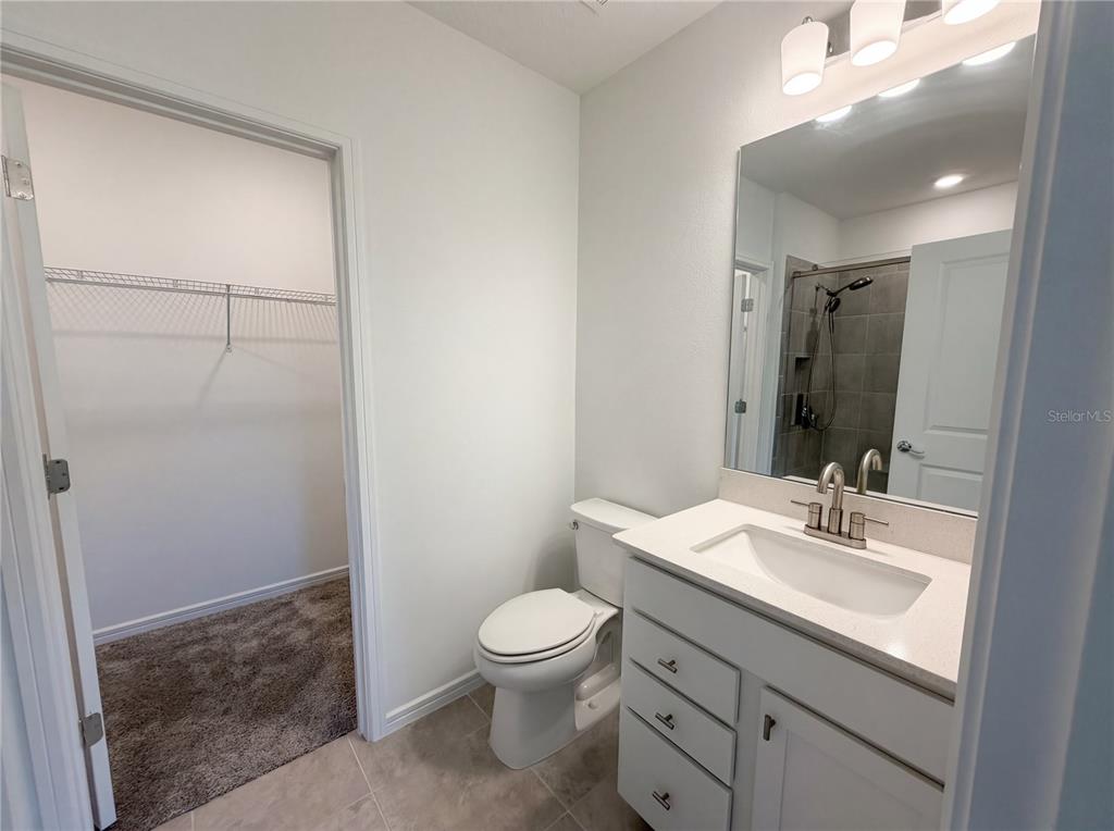 8359 Southwest 54th Street Ocala, FL 34481 - Photo 14 of 26 a bathroom with a toilet a sink and a mirror