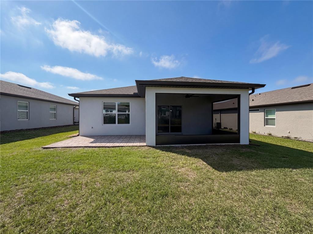 8359 Southwest 54th Street Ocala, FL 34481 - Photo 26 of 26 a front view of a house with a garden and yard