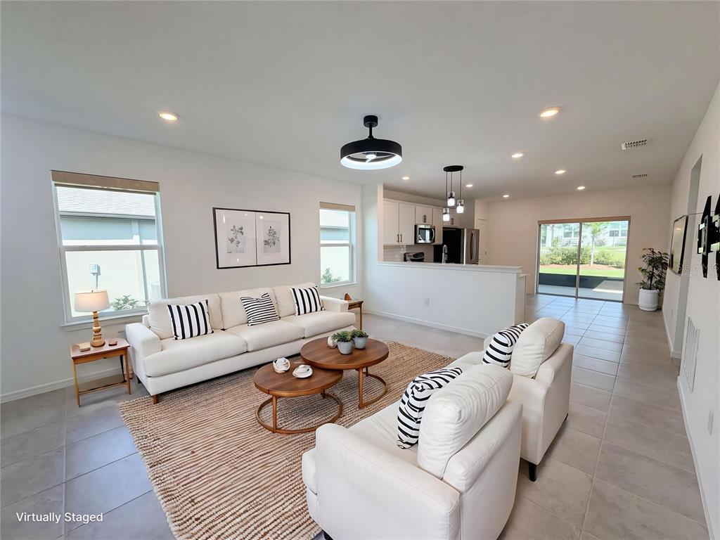8359 Southwest 54th Street Ocala, FL 34481 - Photo 6 of 26 a living room with furniture and a wooden floor
