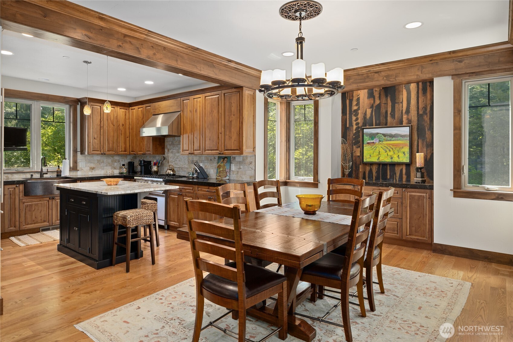 1390 Snowberry Loop Cle Elum, WA 98922 - Photo 15 of 40 a dining hall with stainless steel appliances granite countertop a stove a sink a dining table and chairs