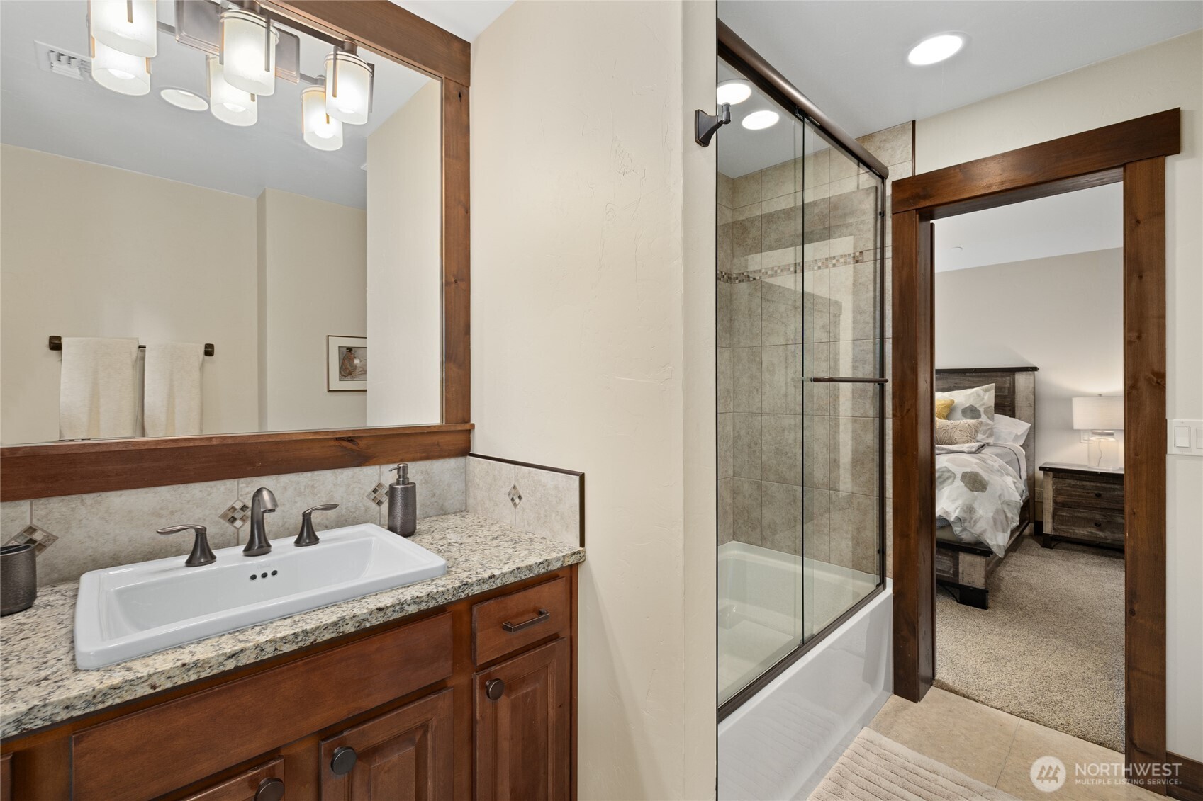 1390 Snowberry Loop Cle Elum, WA 98922 - Photo 29 of 40 a bathroom with a granite countertop sink mirror and shower