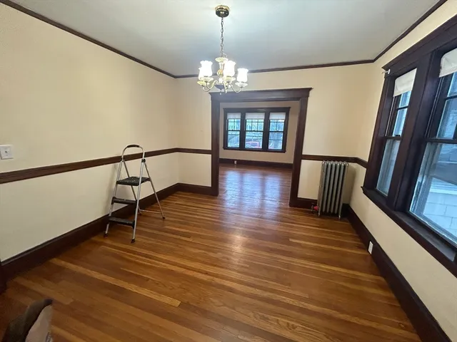 a view of entryway with wooden floor