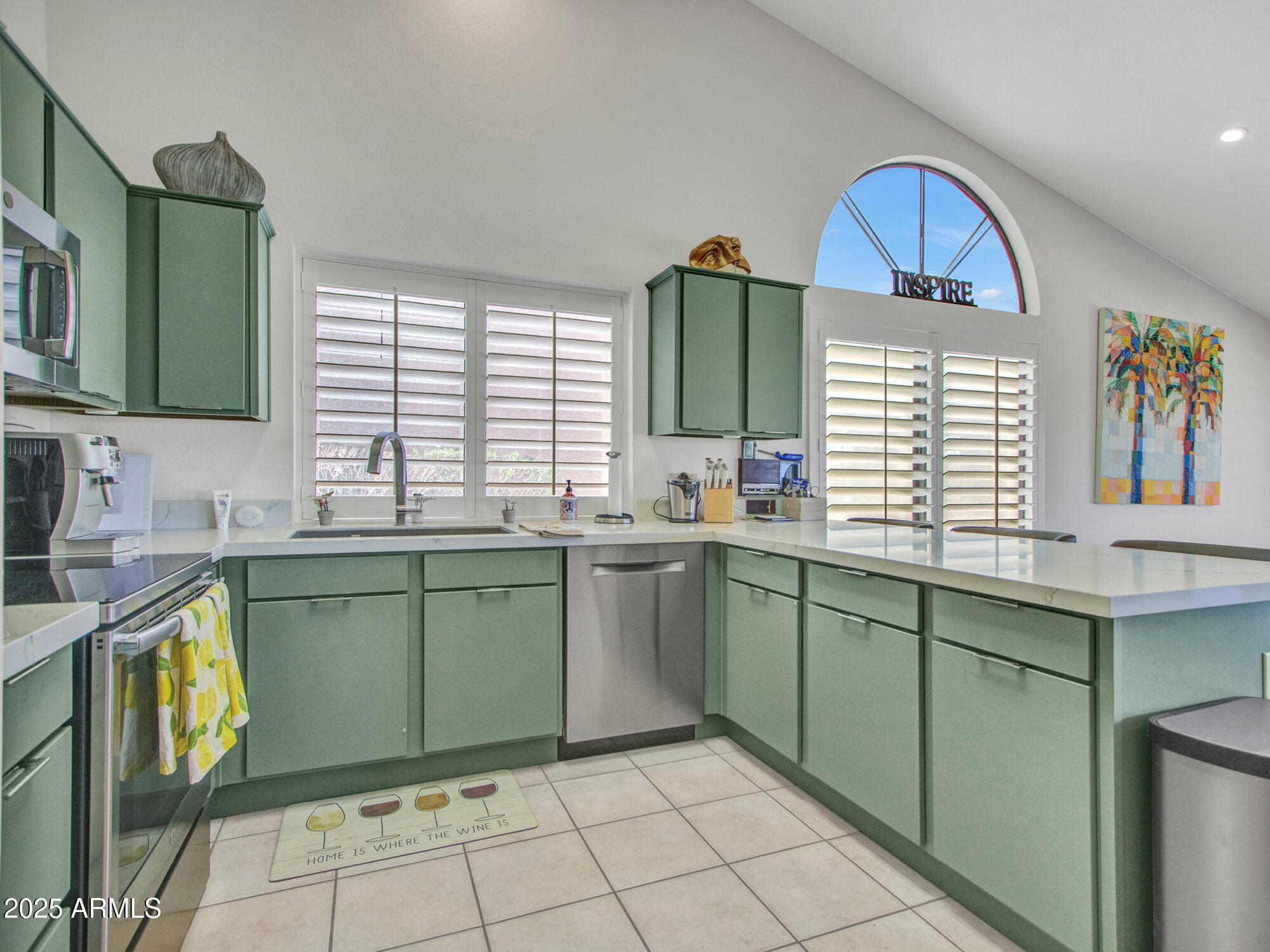 9343 West Escuda Drive Peoria, AZ 85382 - Photo 12 of 51 a kitchen with a cabinets a sink and a window