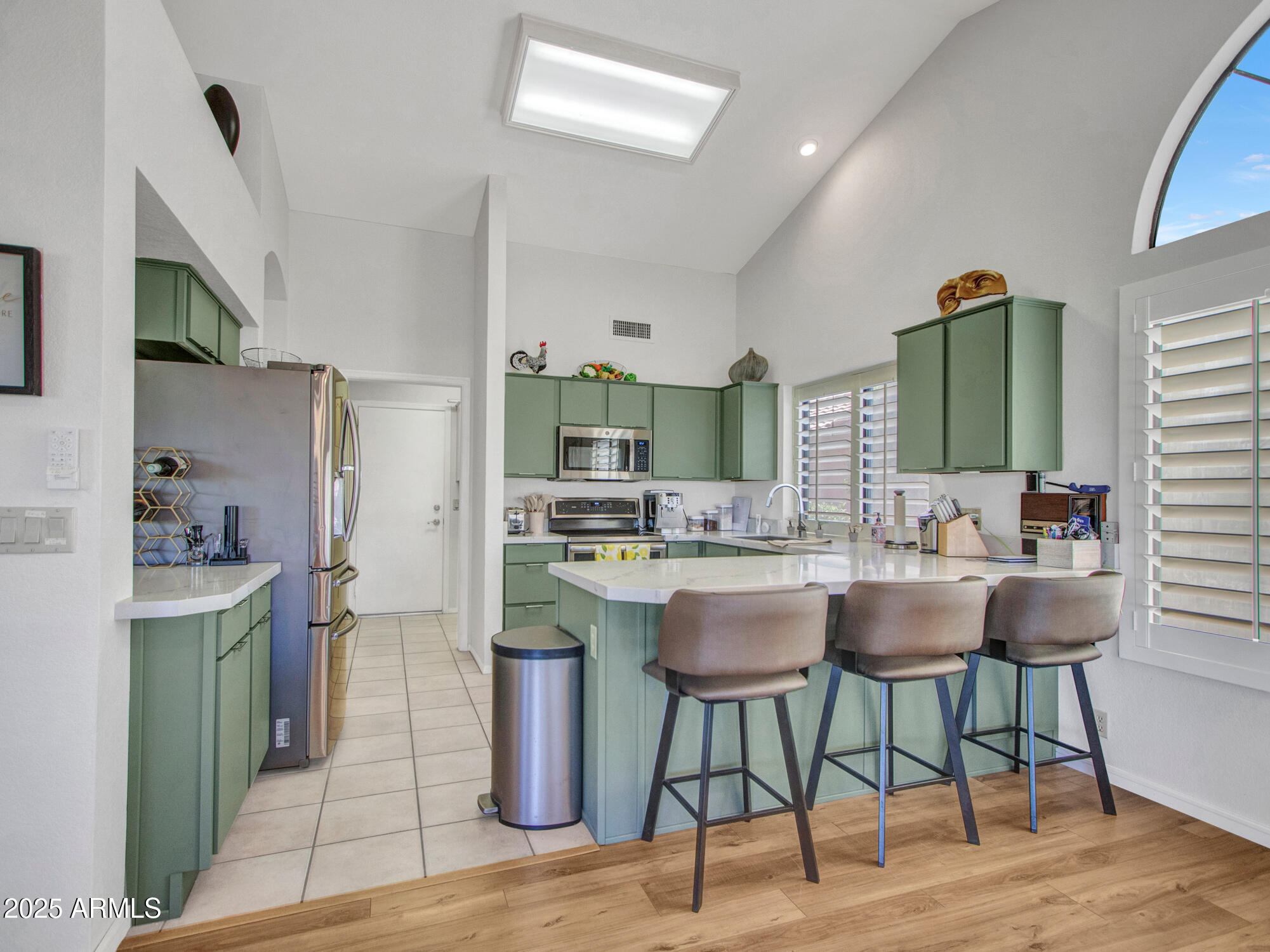 9343 West Escuda Drive Peoria, AZ 85382 - Photo 15 of 51 a kitchen with a sink cabinets and wooden floor