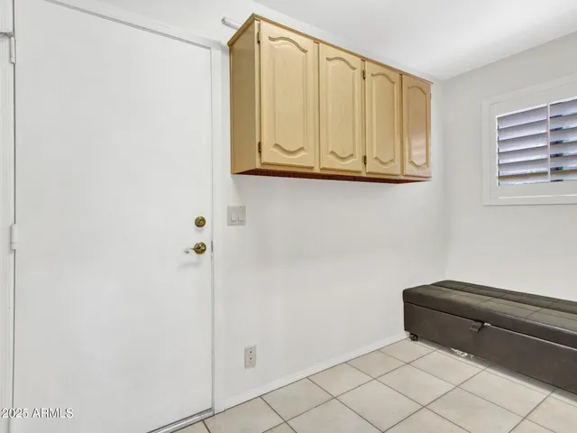 a white refrigerator freezer and a stove sitting inside of a kitchen