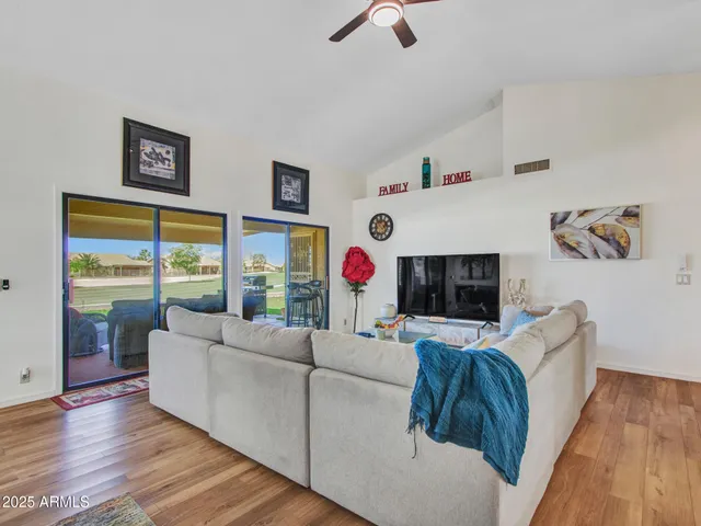 a living room with fireplace furniture and a flat screen tv