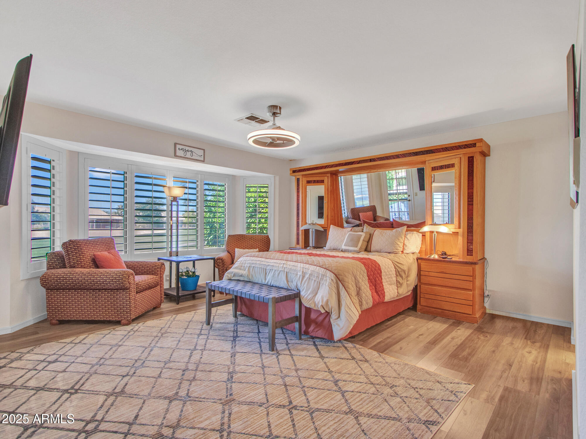 9343 West Escuda Drive Peoria, AZ 85382 - Photo 24 of 51 a bedroom with a bed and glass windows
