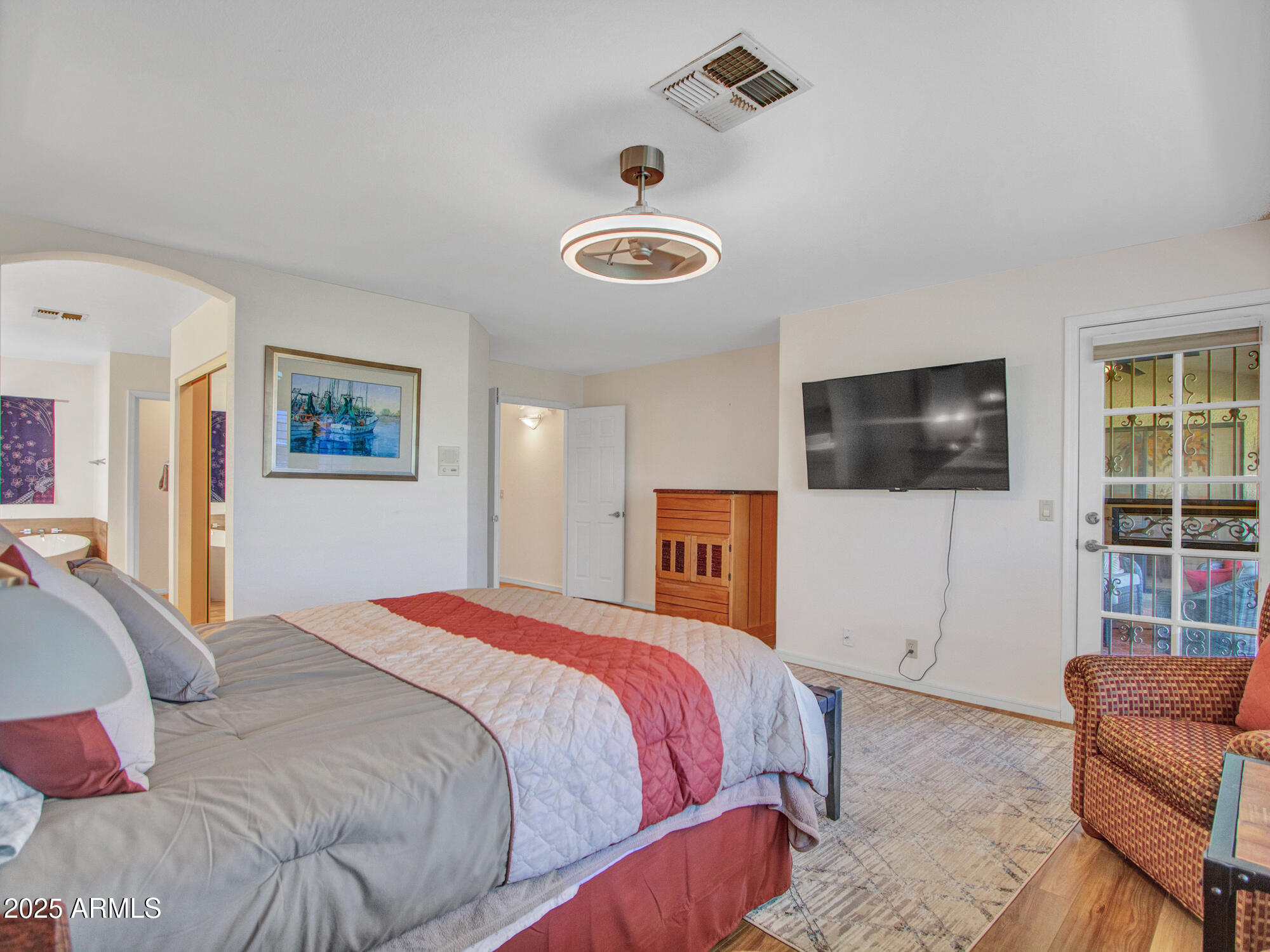 9343 West Escuda Drive Peoria, AZ 85382 - Photo 27 of 51 a bedroom with a bed and a couch