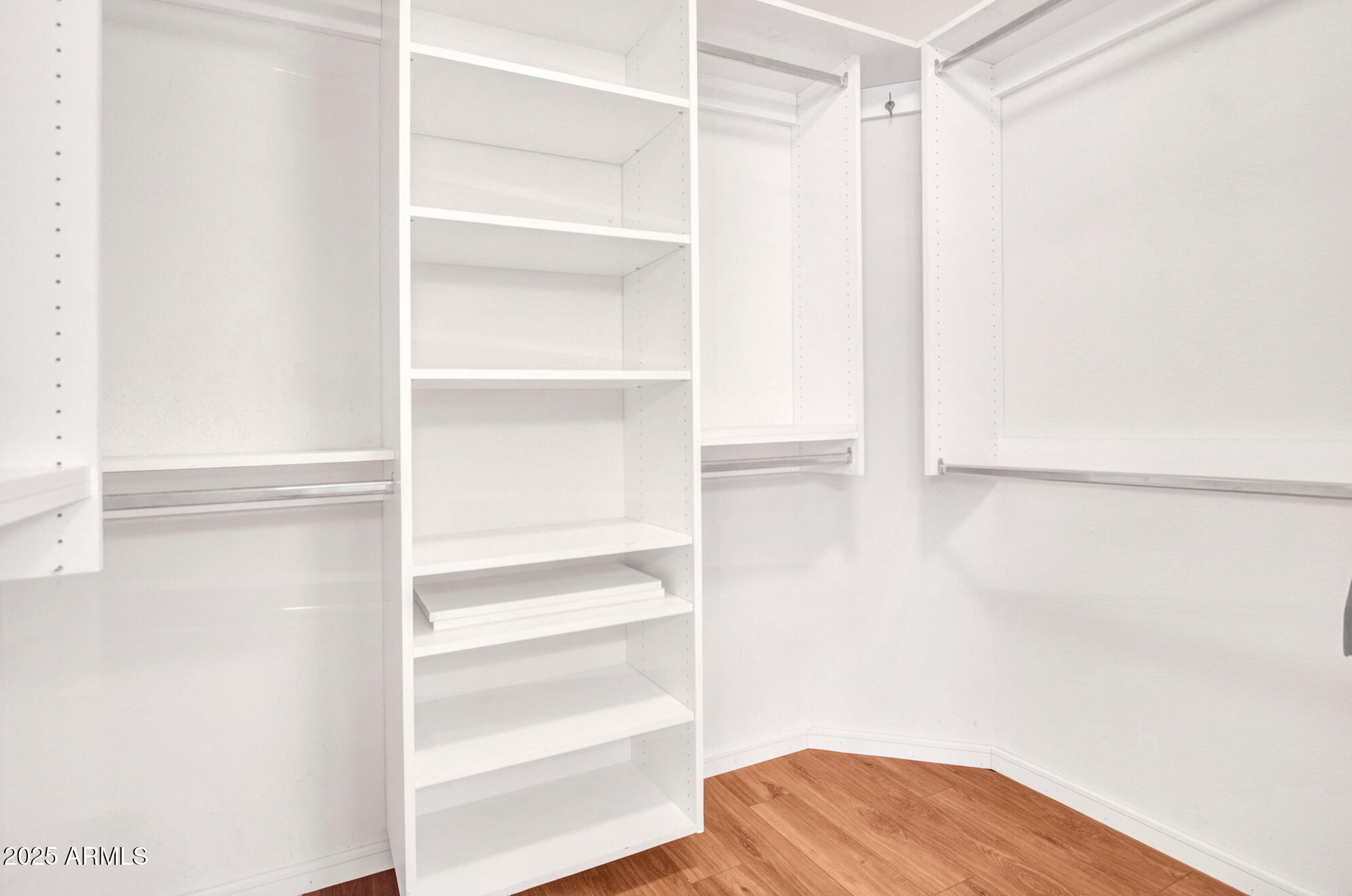 9343 West Escuda Drive Peoria, AZ 85382 - Photo 28 of 51 a view of walk in closet with empty racks