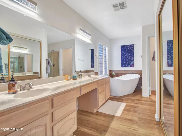 a bath tub sitting in a bathroom next to a window