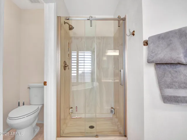 a large spacious bathroom with a granite countertop tub sink and mirror