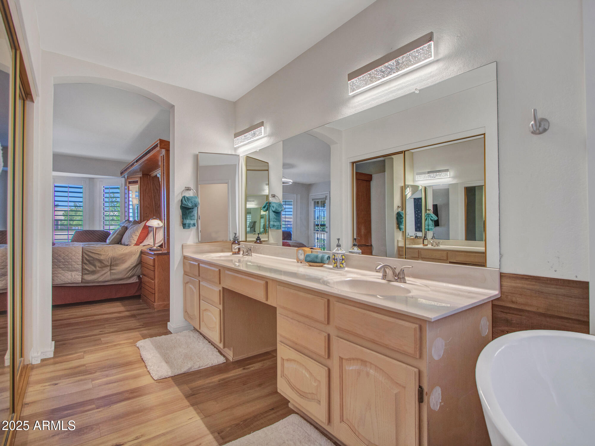 9343 West Escuda Drive Peoria, AZ 85382 - Photo 32 of 51 a spacious bathroom with a granite countertop sink mirror and bathtub
