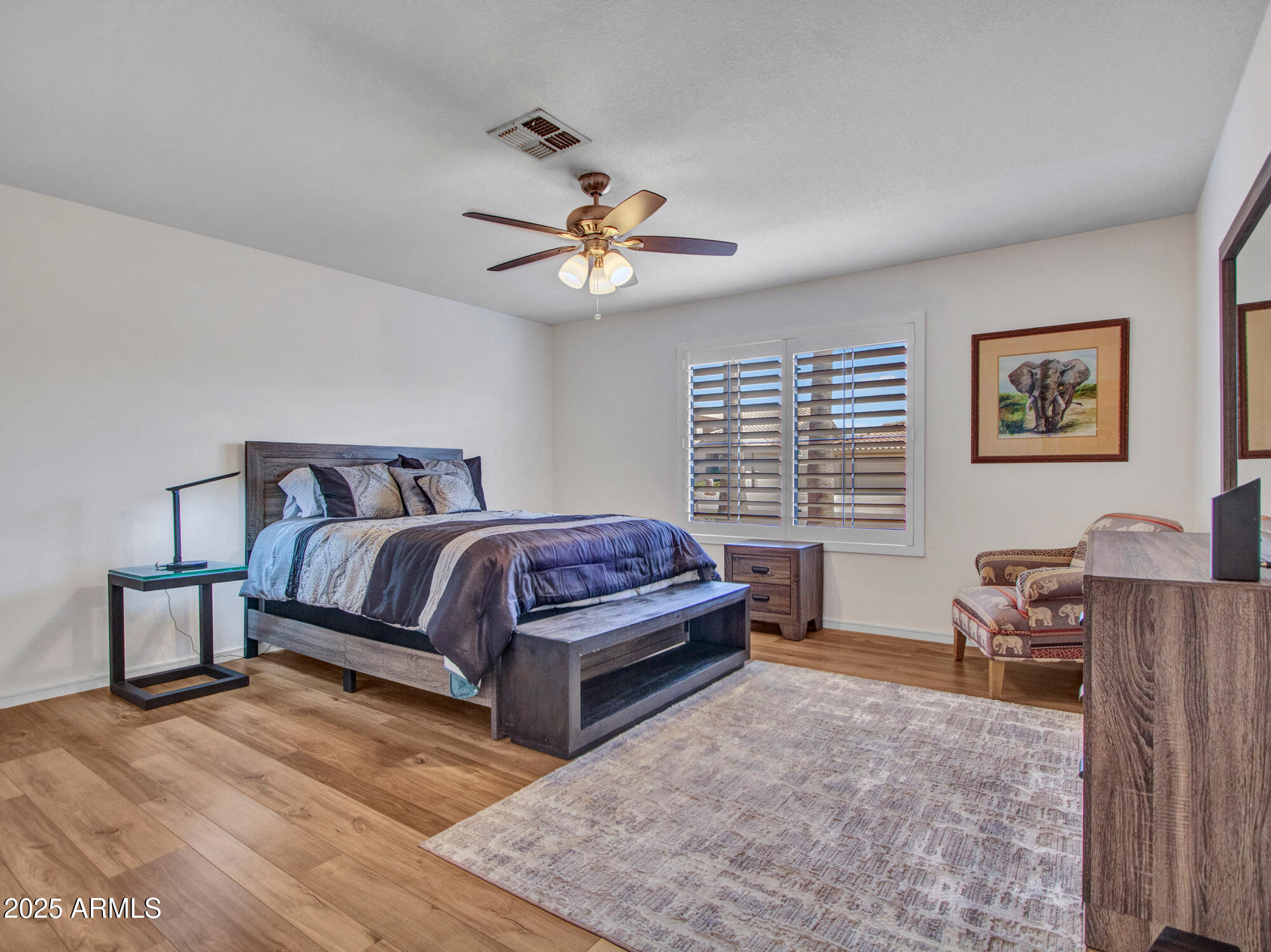 9343 West Escuda Drive Peoria, AZ 85382 - Photo 33 of 51 a bedroom with a bed dresser and a window