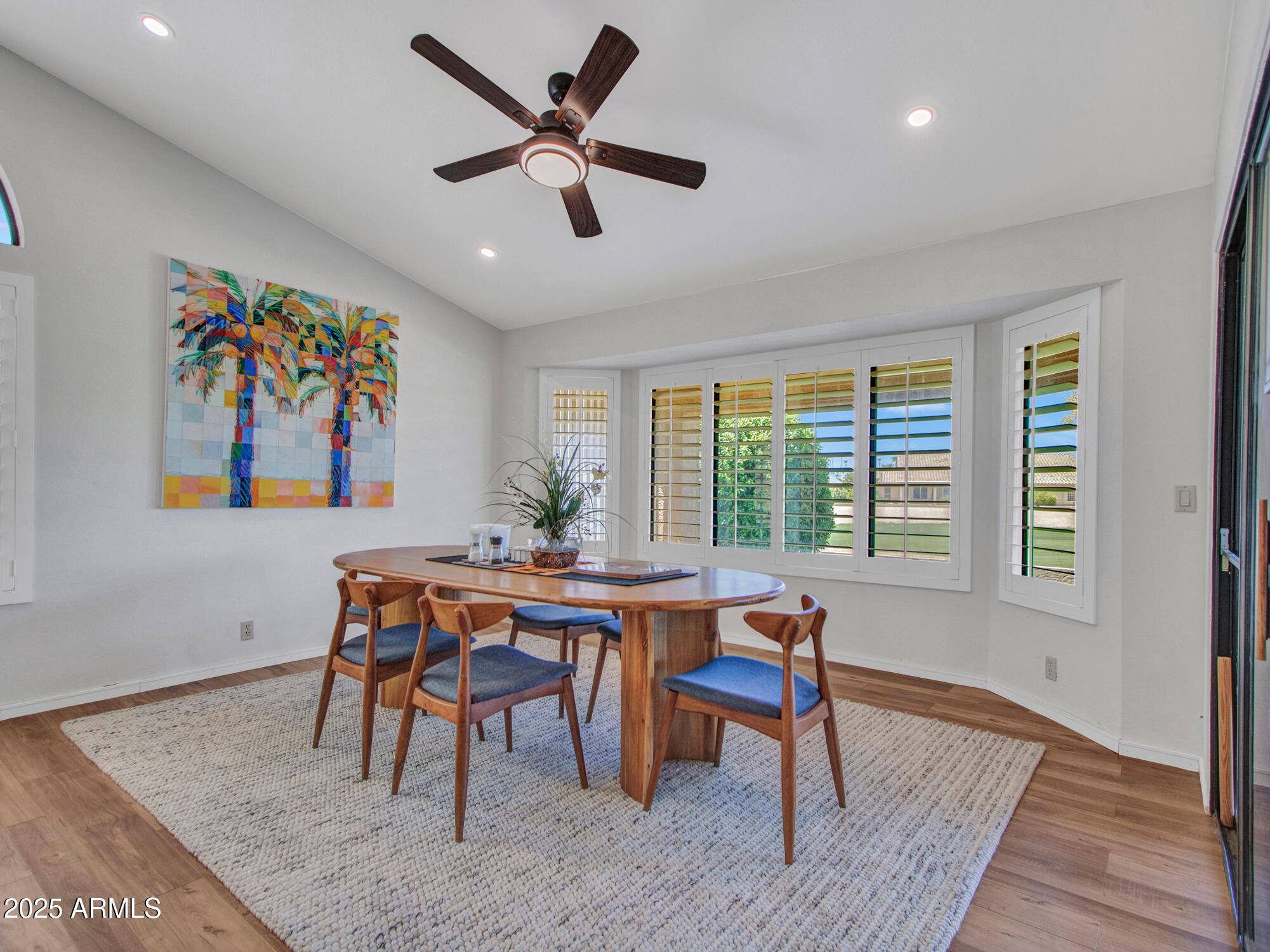 9343 West Escuda Drive Peoria, AZ 85382 - Photo 35 of 51 a dining room with furniture a rug and a large window