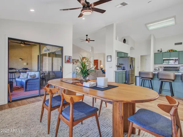 a view of a dining room with furniture window and outside view