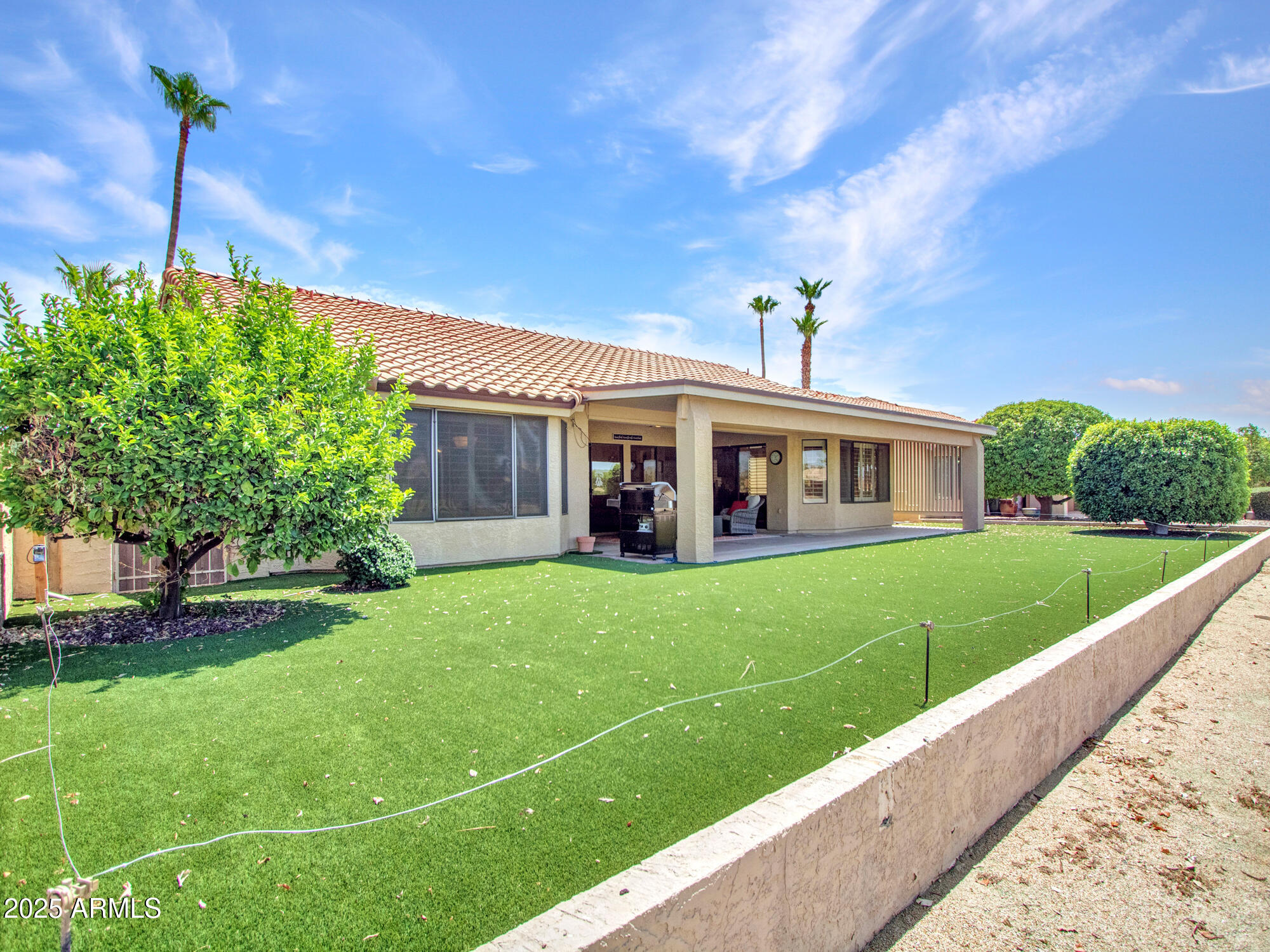 9343 West Escuda Drive Peoria, AZ 85382 - Photo 42 of 51 a front view of a house with a yard