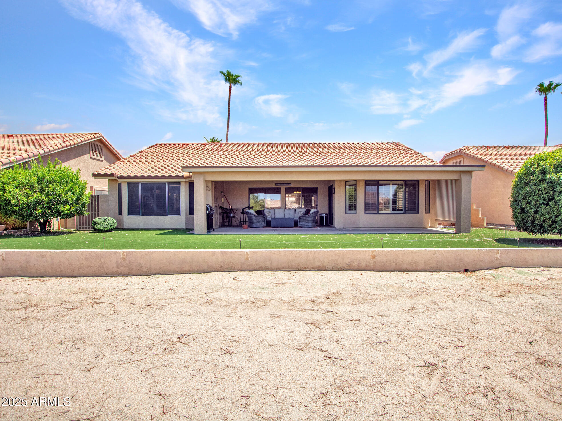 9343 West Escuda Drive Peoria, AZ 85382 - Photo 44 of 51 a front view of house with yard and green space