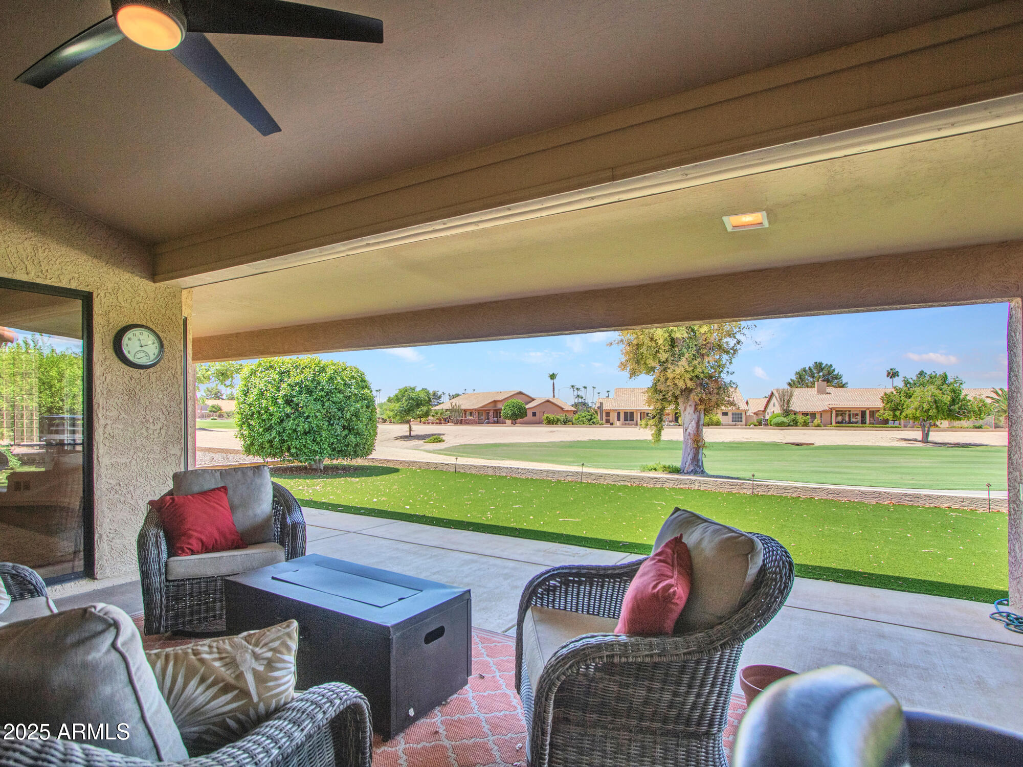 9343 West Escuda Drive Peoria, AZ 85382 - Photo 47 of 51 a room with furniture and a floor to ceiling window