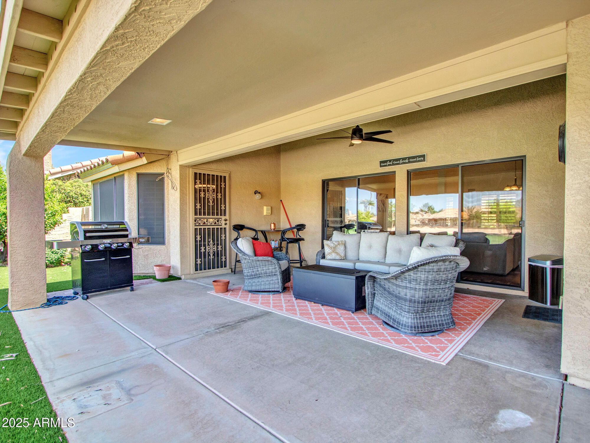 9343 West Escuda Drive Peoria, AZ 85382 - Photo 48 of 51 a living room with furniture and a large window