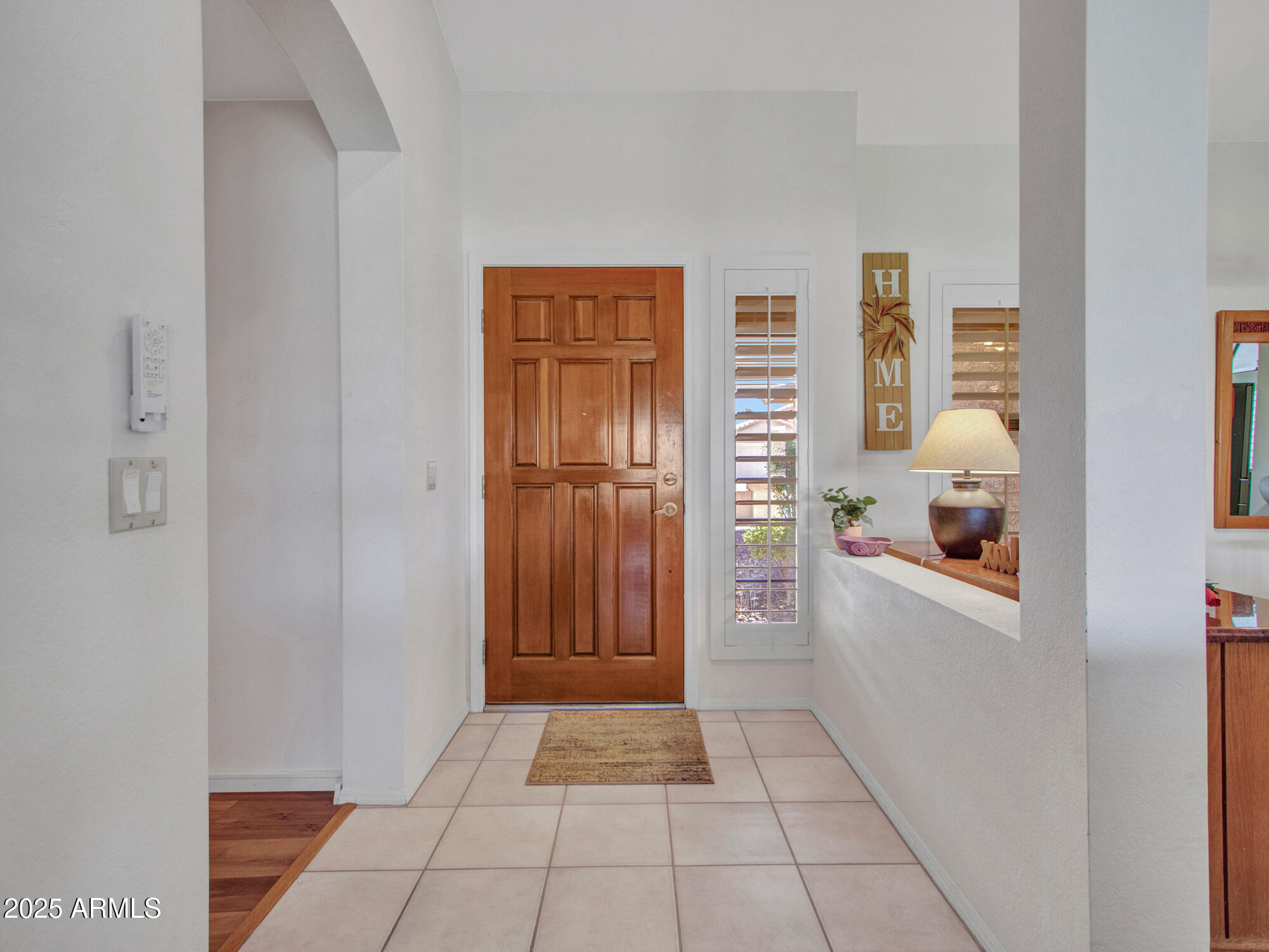 9343 West Escuda Drive Peoria, AZ 85382 - Photo 5 of 51 a view of a closet area with living room