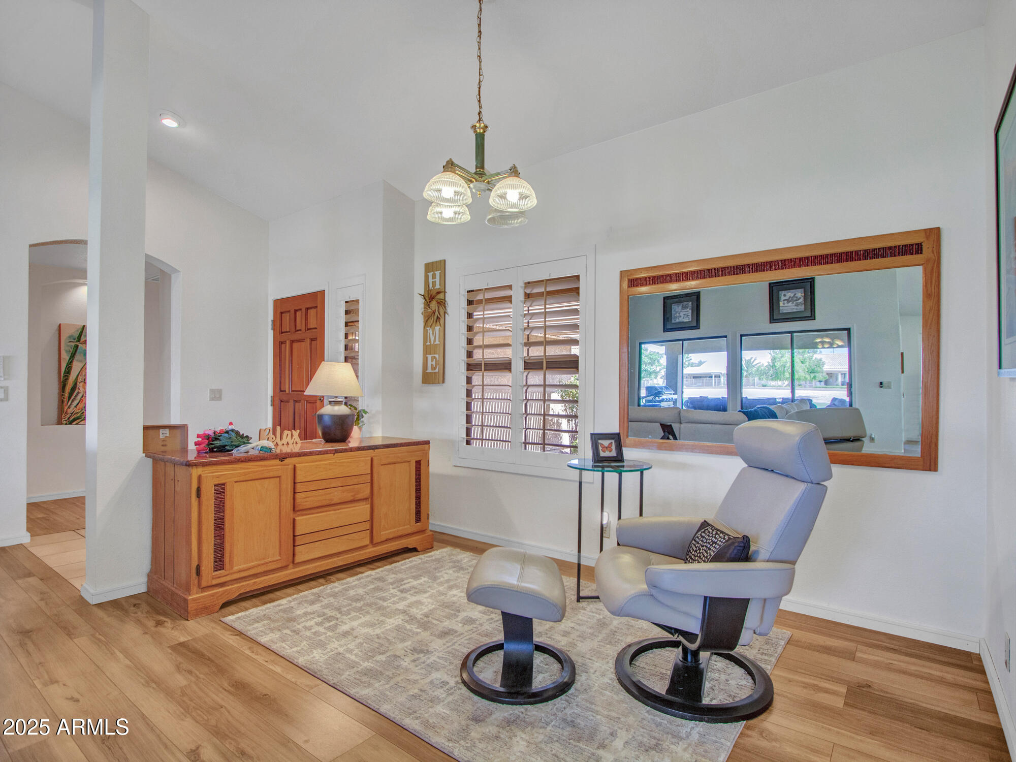 9343 West Escuda Drive Peoria, AZ 85382 - Photo 7 of 51 a living room with furniture and wooden floor