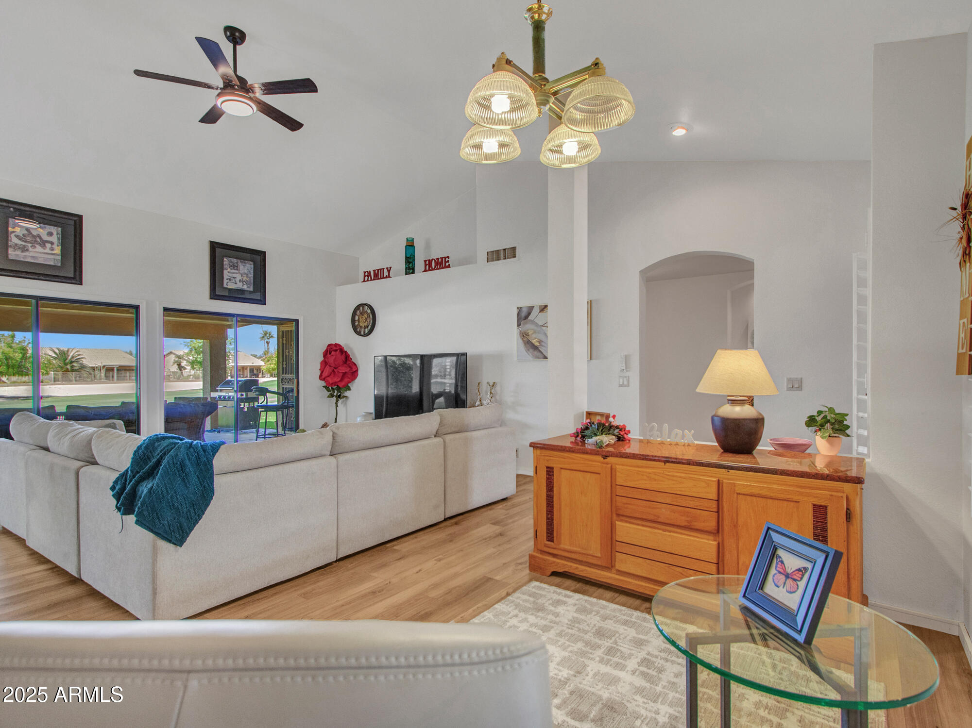 9343 West Escuda Drive Peoria, AZ 85382 - Photo 8 of 51 a living room with furniture and a chandelier
