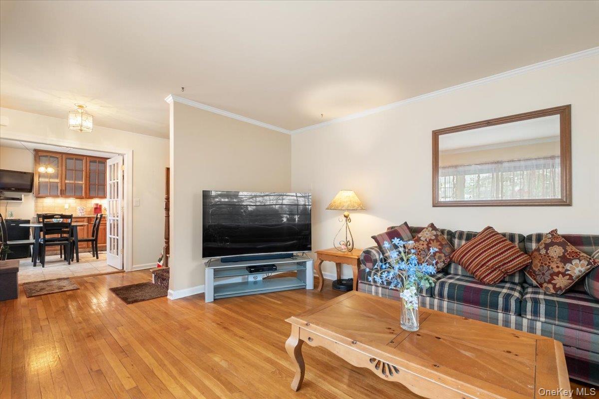 149 Hilburn Road Scarsdale, NY 10583 - Photo 8 of 41 a living room with furniture and a flat screen tv