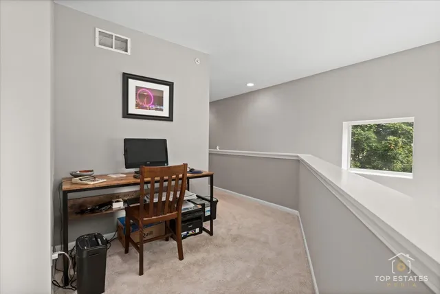 a workspace with furniture and a window