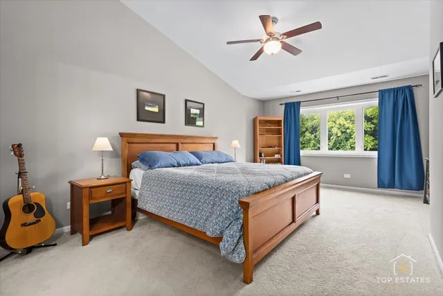 a bed sitting in a room next to a window