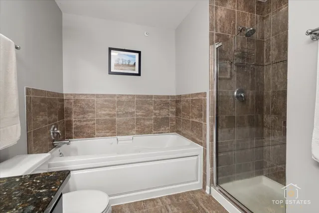 a bathroom with a bathtub and shower