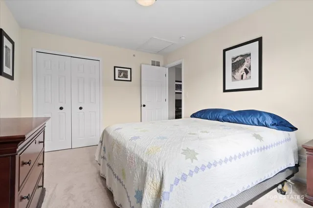 a bedroom with a bed and a cabinets