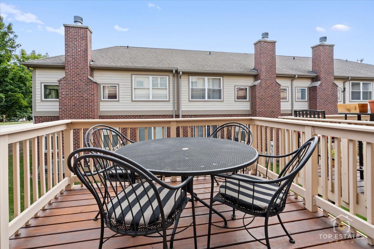 1651 Pauline Circle, Unit 1651 Mundelein, IL 60060 - Photo 34 of 42 a view of a roof deck with table and chairs