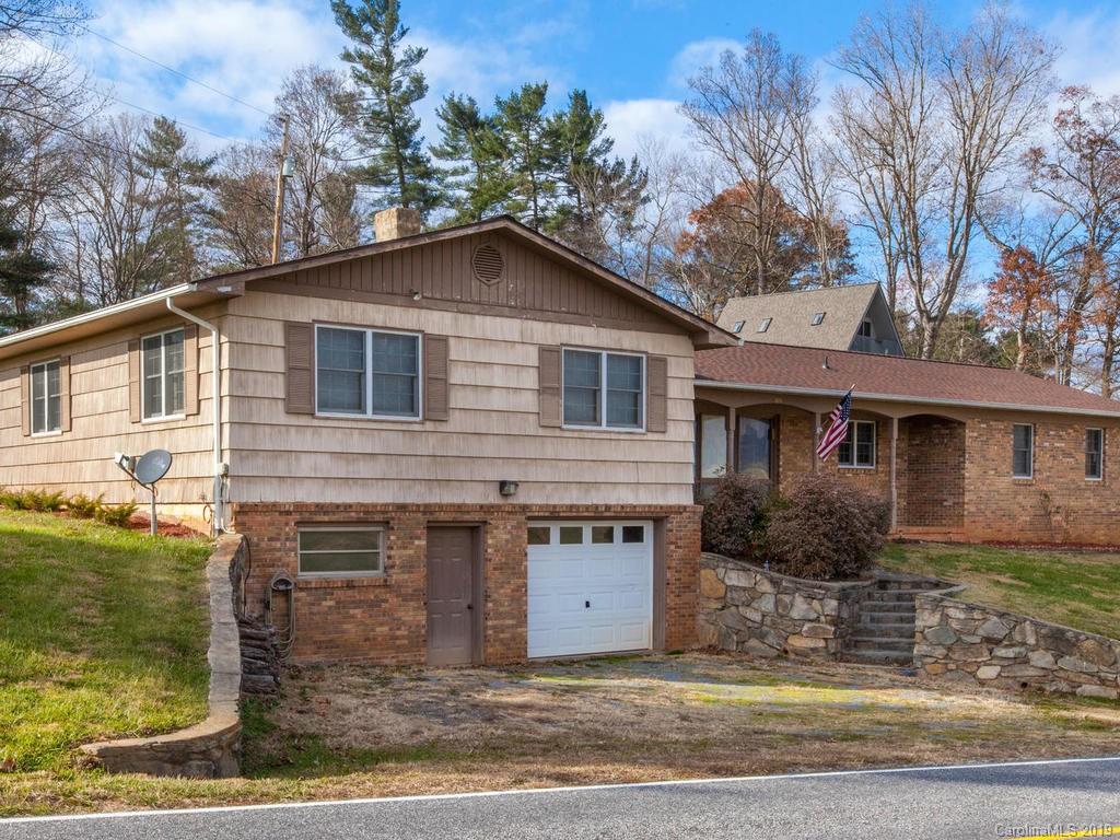 2533 Iron Duff Road Waynesville, NC 28785 - Photo 1 of 35 a front view of a house with garden